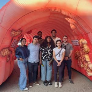 Students shown in a model of a human colon.