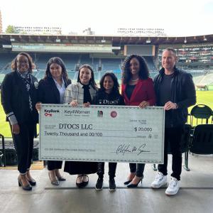 group holding up honorary check