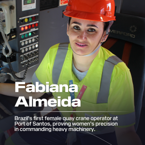 Fabiana Almeida wearing orange hardhat and yellow vest sitting by control panel and phone