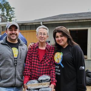 Two volunteers delivering food