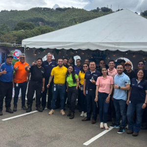 Group photo outside under a tent