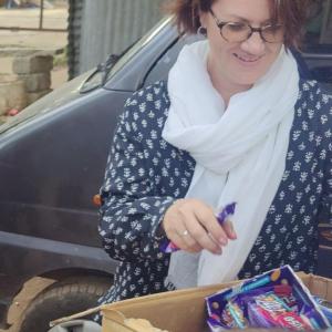 Kim Frankovich looking a cardboard box