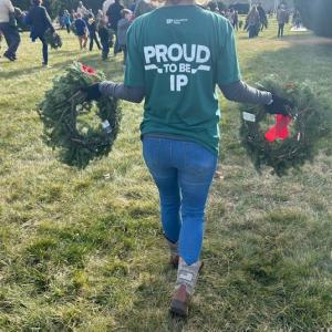 person holding up wreaths