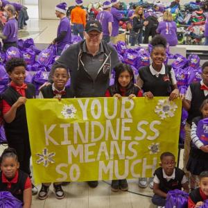Your Kindness Means so Much sign with group smiling