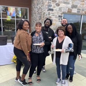 Group of visitors at the zoo enjoying a meal.