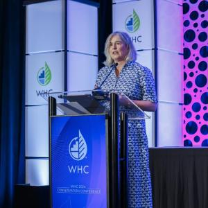 Margaret O'Gorman speaking onstage at the 2024 WHC Conservation Conference