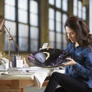Sitting woman looking at a bowl