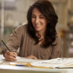 Woman writing with pencil