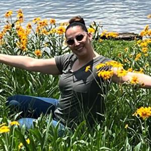 Kandyce Reyna in a field of flowers