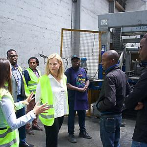 Laura Kohler meeting with group in yellow high visibility jackets
