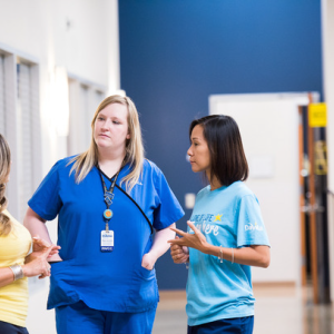 A healthcare worker talking with patients