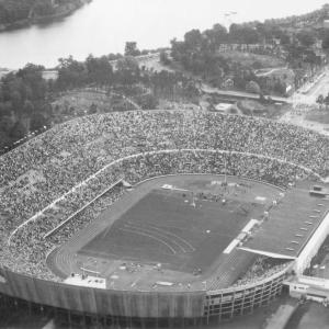 aerial view of a large stadium, spectators in the stands