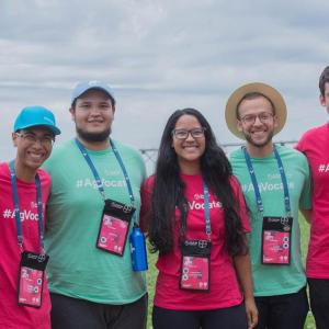 Seven students and adults wearing #agvocate t shirts and lanyards