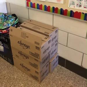 stacks of boxes marked "always" in a school room