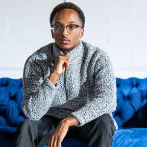 Anwar Dougsiyeh, co-founder of Lotus Rosery Music Festival, inside of his office in midtown Atlanta. Credit: Cliff Robinson