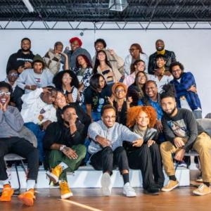 Dougsiyeh is surrounded by family, Lotus Rosery staff, and friends at his midtown office. Credit: ​​Cliff Robinson