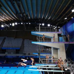 In an aquatic center with multiple-height diving boards.