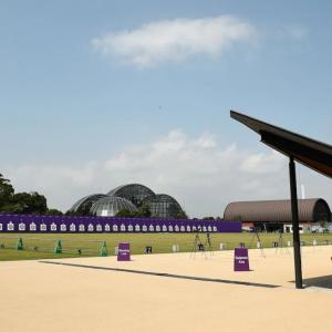 a long archery range and covered shelter. A domed building in the background