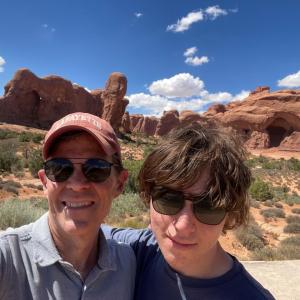 John Mulcahy and family member posed in a scenic natural area.