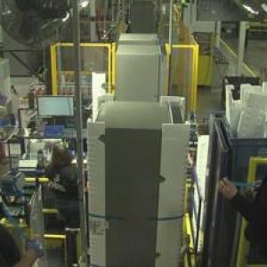 two workers assembling parts