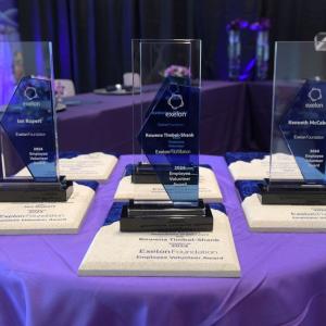 A table with six award trophies