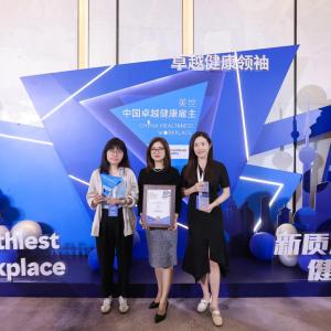 people posing at awards ceremony