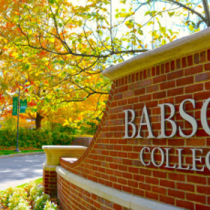 Babson College sign on a brick wall.