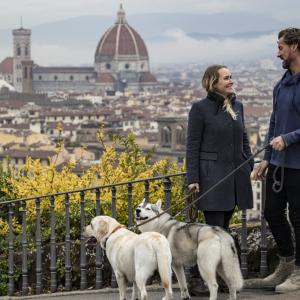 Stefanie and Steve walking their two dogs in Florence, Italy