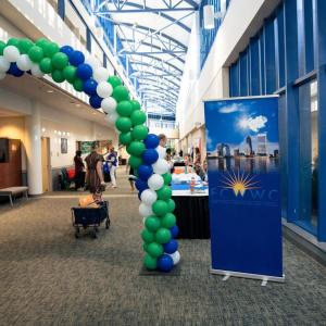 A balloon arch at the entrance of a building.