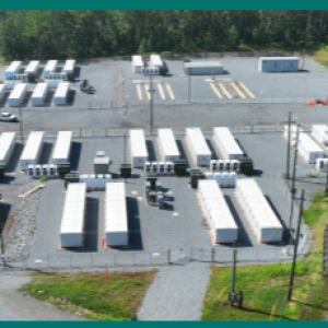 Aerial view of a paved lot with multiple storage trailers.