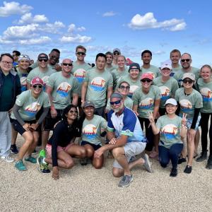 A group posed on a beach.