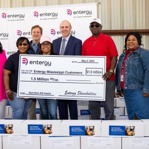 Group photo with large check