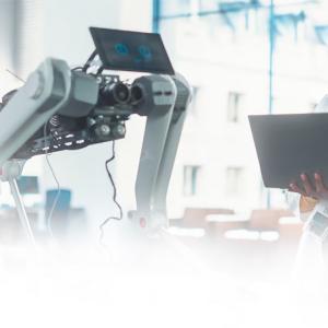 A person holding a laptop 