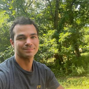 A person on a bike outdoors.