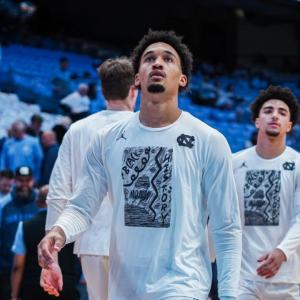UNC basketball players wearing the student-created t-shirt design 