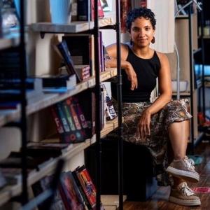 A person sitting in a bookstore