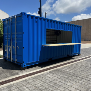 Blue up-cycled shippping container mobile retail space