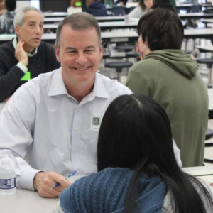 GP employee Bob Berry talking with a student