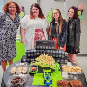Employees with snacks and RC car