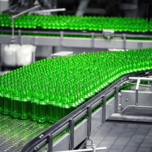 Green bottles on an assembly line