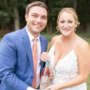 Kyle and his wife dig up a bottle of Yellowstone Kentucky Straight Bourbon Whiskey on their wedding day.  ©Virginia Ashley Photography
