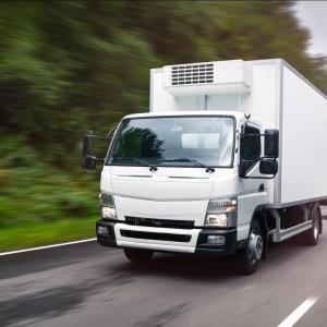A large vehicle driving down the road