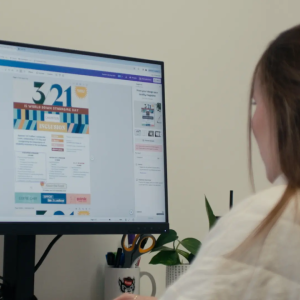 Someone looking at a monitor