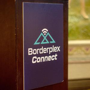 A podium with text "Borderplex Connect"