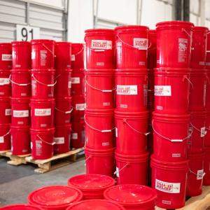 Stack of flood relief buckets donated from Southwire