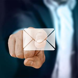 A person pointing at an email illustration 