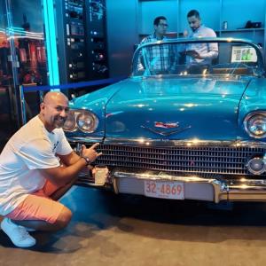 Robert with a fancy aqua car