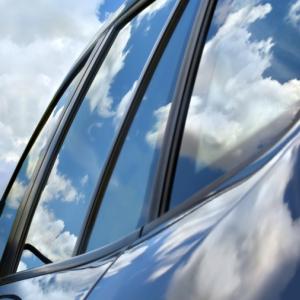 car with blue sky and clouds