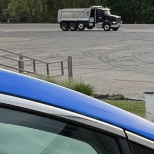 A car parked next to an electric charger