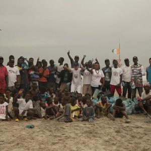 A large group photo on the beach